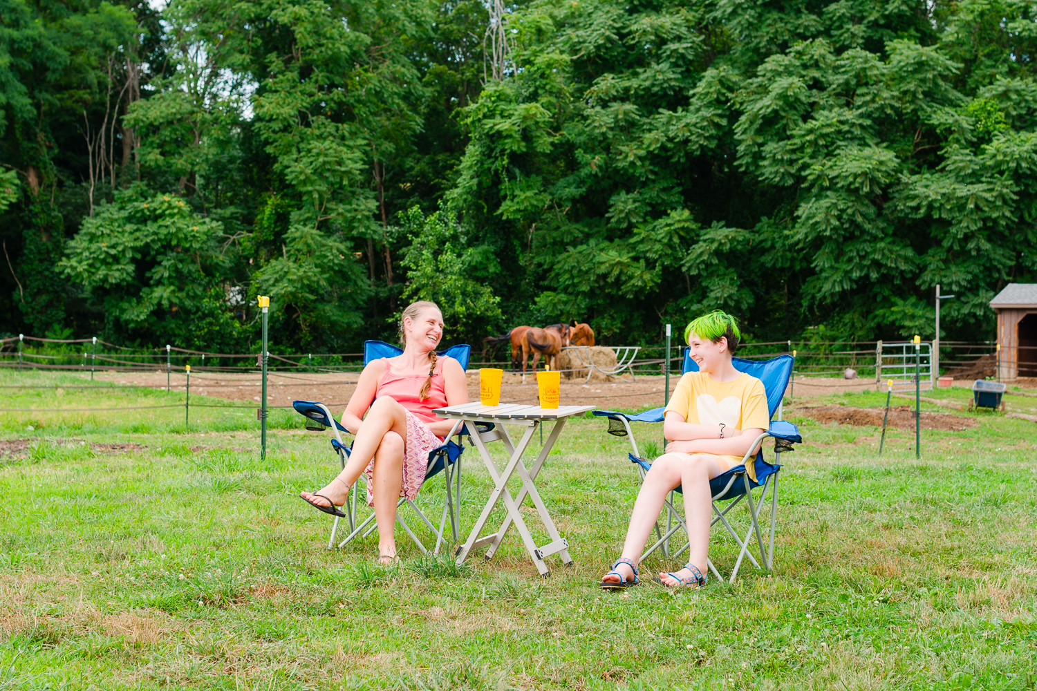Enjoying the outdoors with a view of the horses
