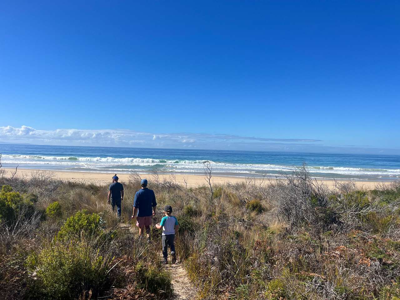 A short walk through the trees to the iconic Neck beach.