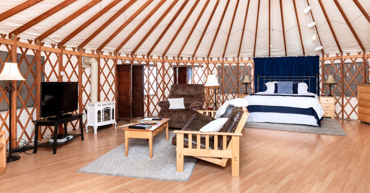 All of our yurts have a similar set up with a few differences. This is the living room of one of our Vista Yurts.