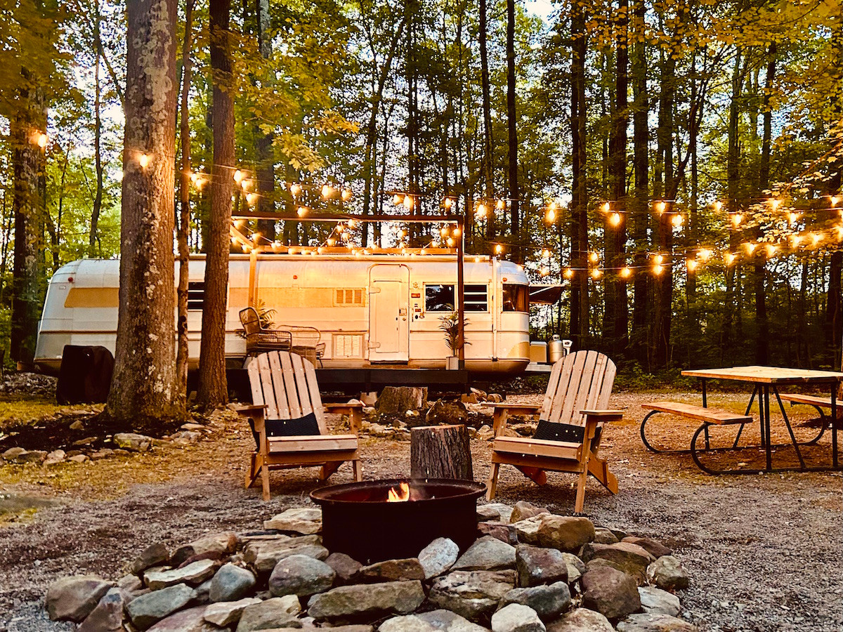 Tilly, our retro camper at Rustic Acres — unique glamping experience with comfort, charm, and scenic forest views.