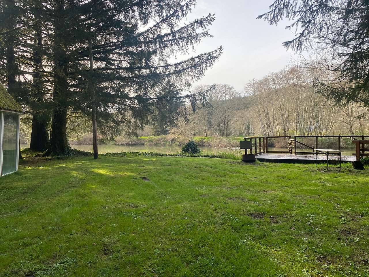 View of the campsite looking toward the River. You have your own deck looking over the river. There is no access to the water from this deck. 