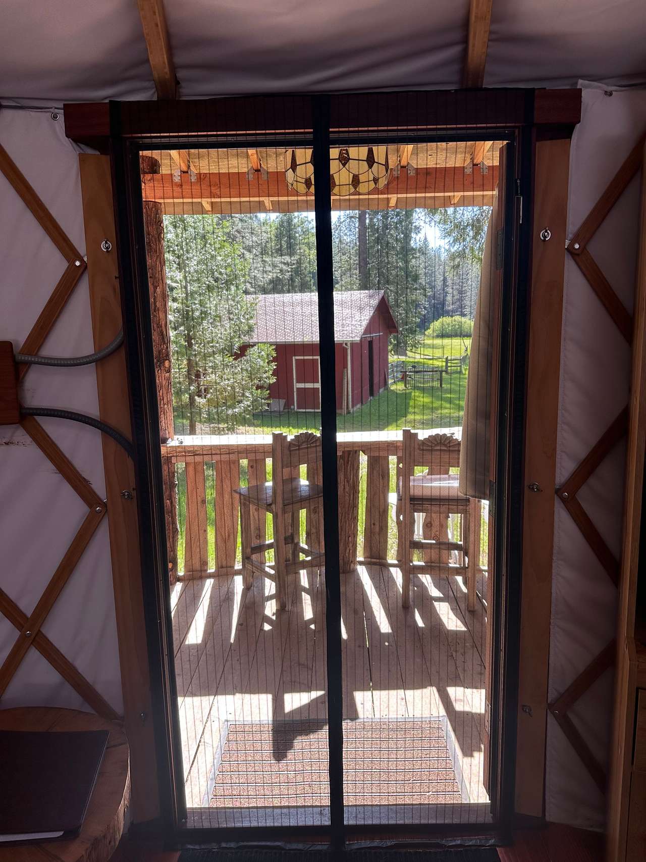 Mesh screen door now installed to catch that lovely Westerly breeze to help keep the yurt cool this summer!