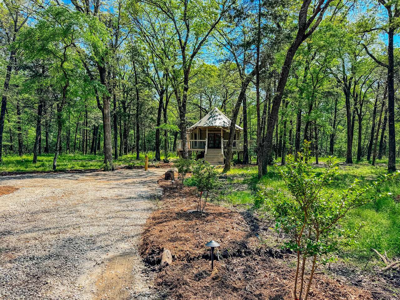 Luxury glamping safari tent located in five acres of wooded Texas countryside just 90 minutes of Dallas, Texas