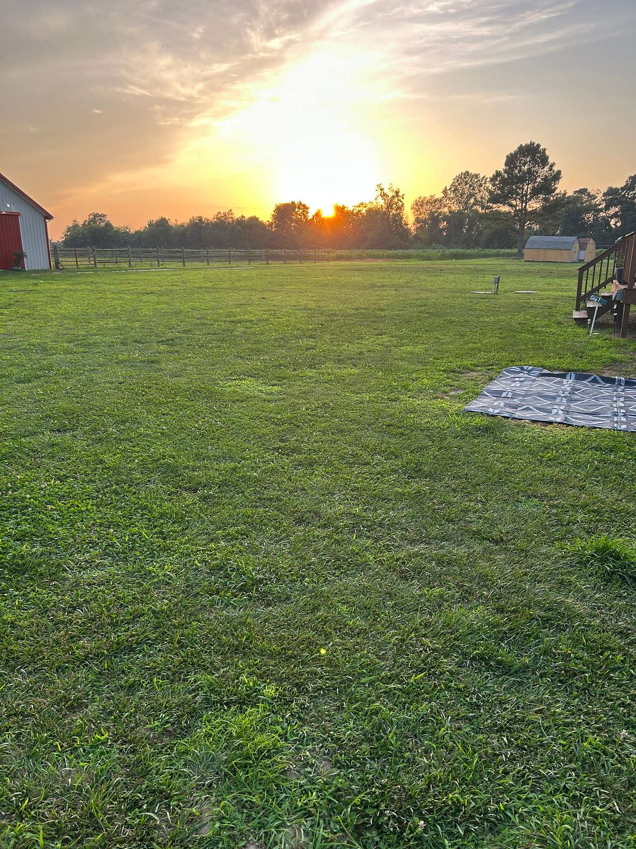 This is where you will park. Next to my camper and the 30 amp is on the deck and spigot is near there as well. 