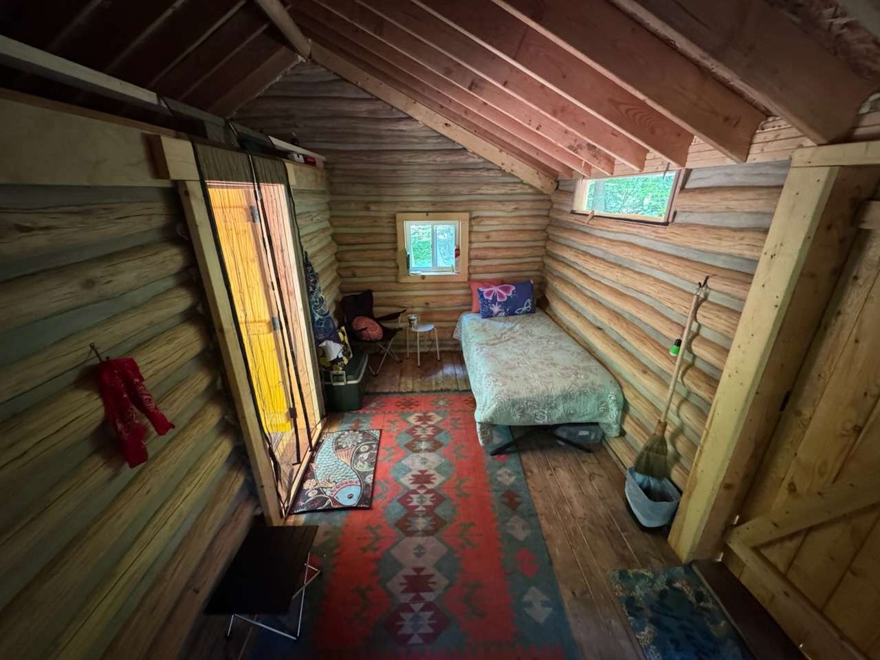 One twin bed setup with an additional cot in cabin and loft above. 