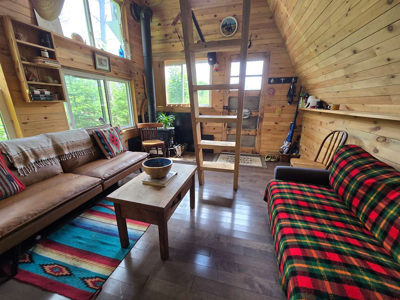 Cozy cabin with futon and pull out sofa for extra guest sleeping.