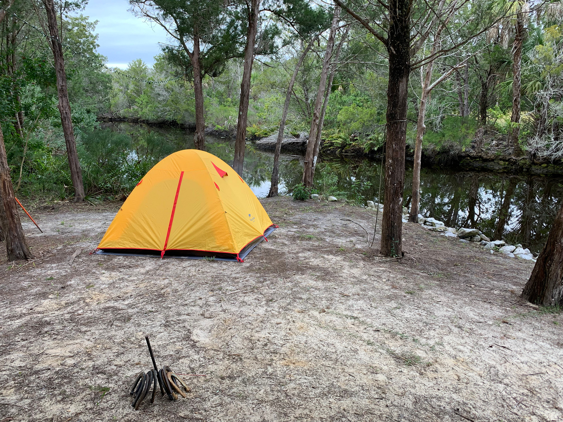 This specific area has grown in a bit with vegetation by the river. So there isn’t as much room for a tent anymore.