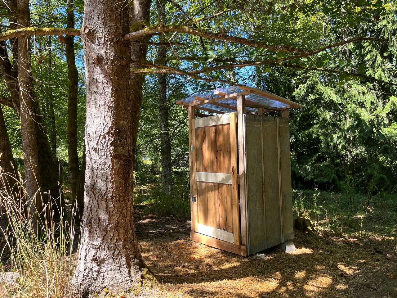 Rustic outhouse with composting toilet.