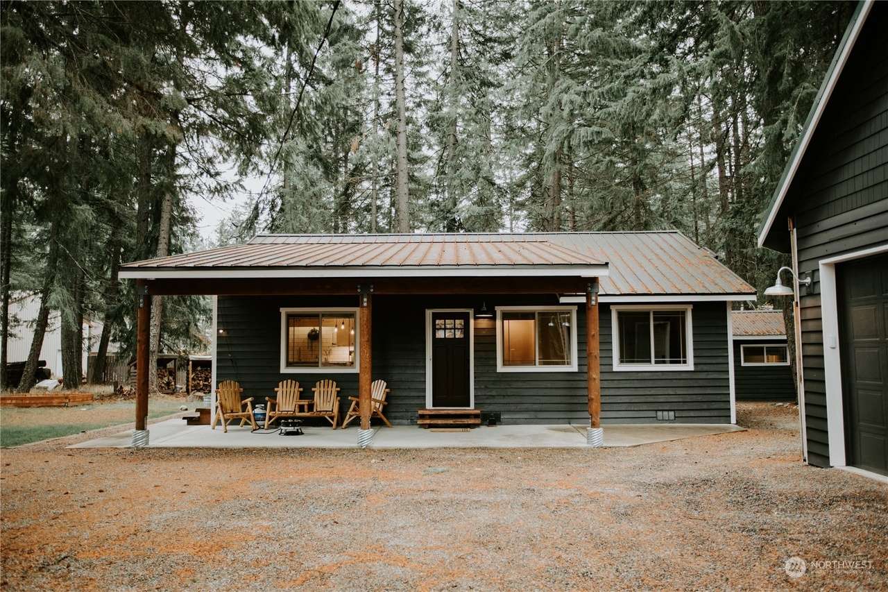 The property includes the 3-bedroom 1 bath house, a garage/game room, and a studio (king bed, kitchenette, bathroom). 