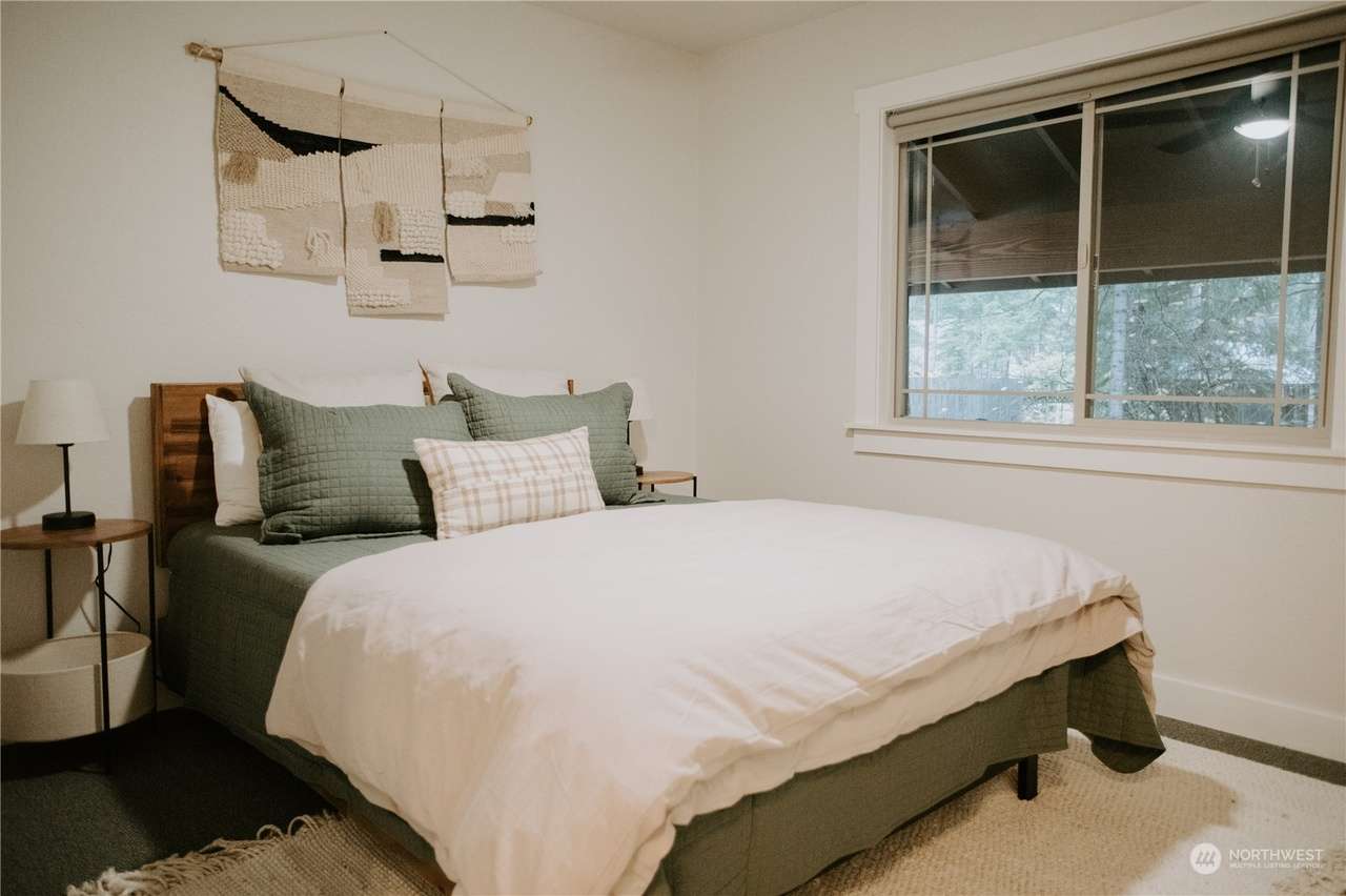 Two of the bedrooms in the main house have queen beds. 