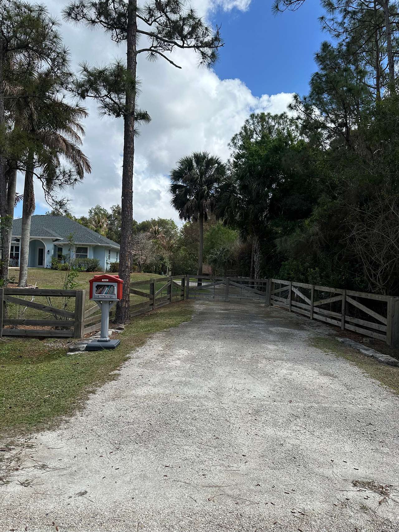 Entrance to parking spot with a little library outside! 