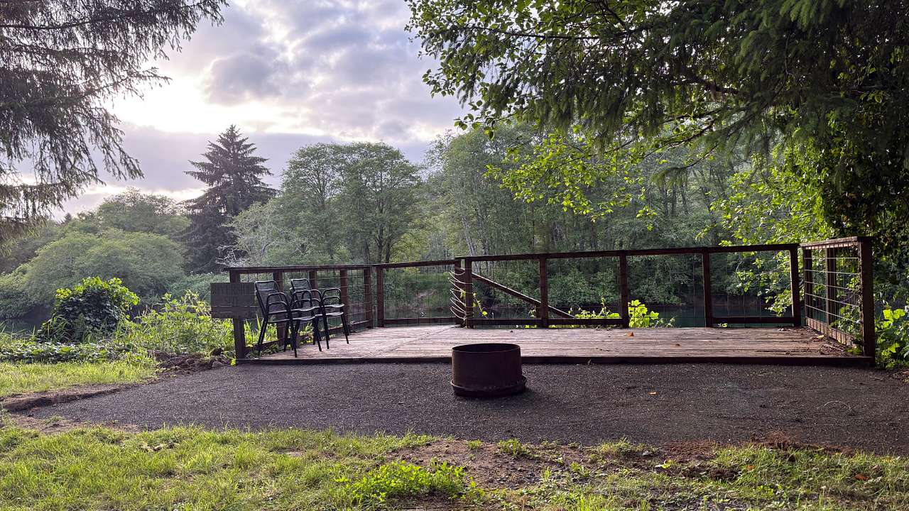 A new and improved area for gathering around the firepit. We have also secured the delapitated stairs with a new railing for everyone's safety
