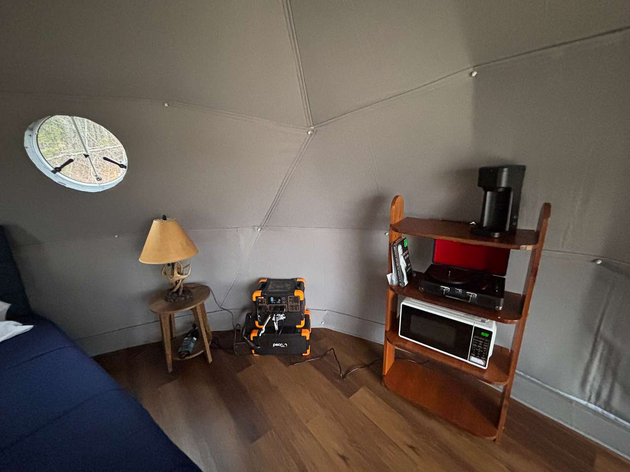 Off-grid power station, refrigerated cooler, air conditioner, microwave oven, record player, coffee station.