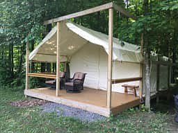 Brand-new boutique safari tent in 2021 on raised wooden platform.