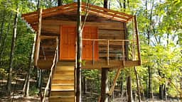 treehouse shower house provides hot showers... it is in the extras. Located at main camp 265 Neck Rd.  not included in price of  primitive sites, but available to all campers in extras