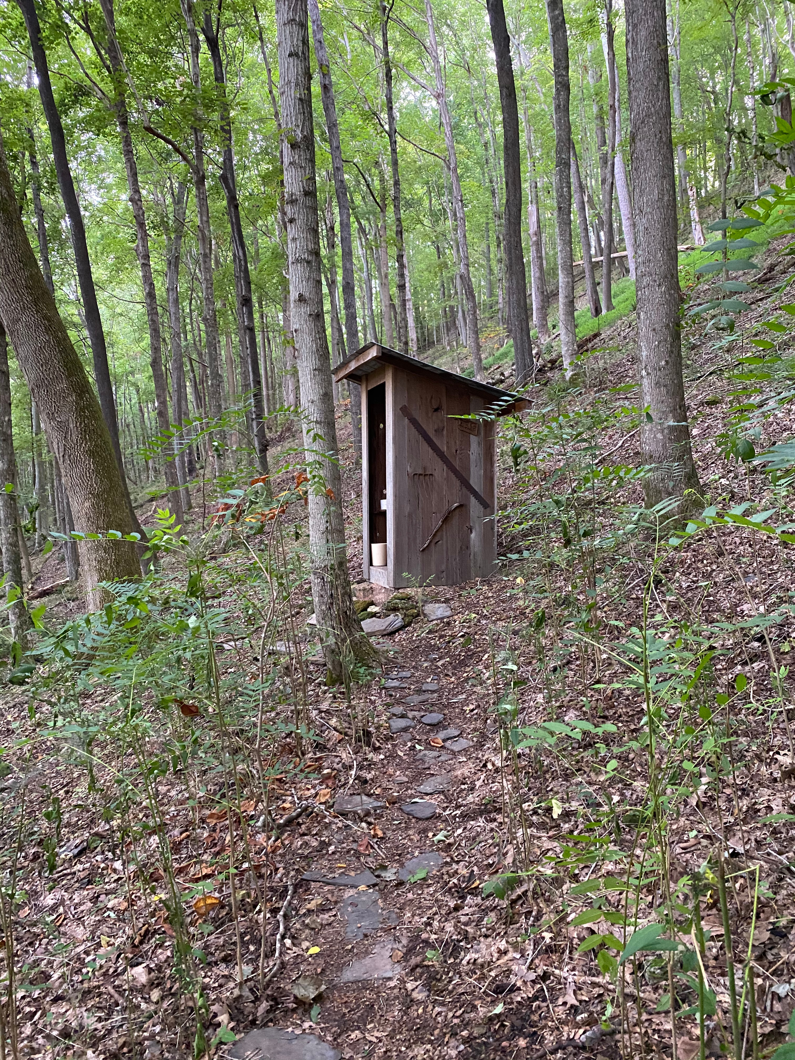 Clean and comfortable outhouse with a lovely view